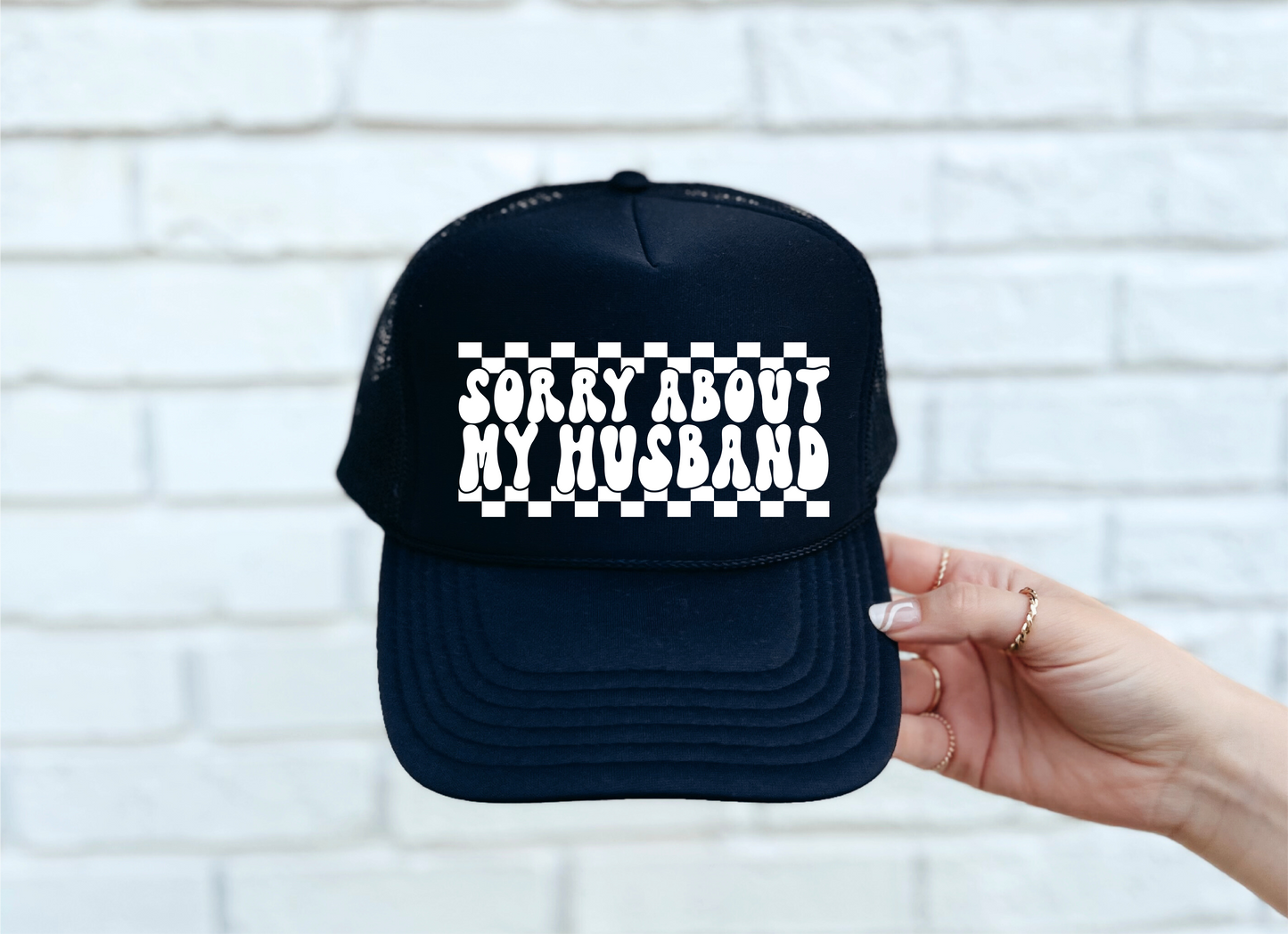 Sorry About My Husband DTF Printed Black Trucker Hat/White Text